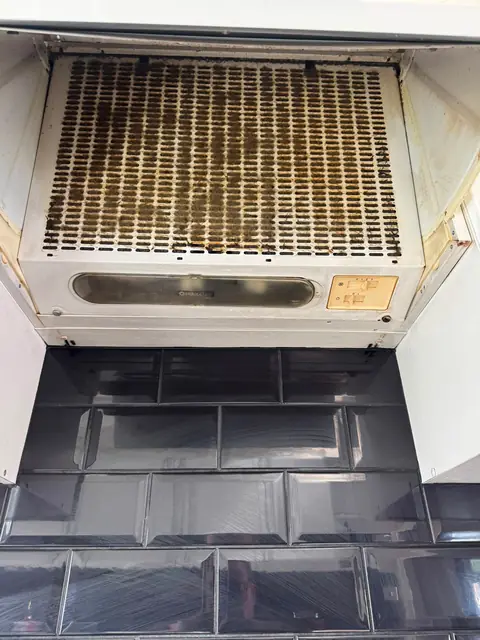 Greasy extractor hood filter before cleaning