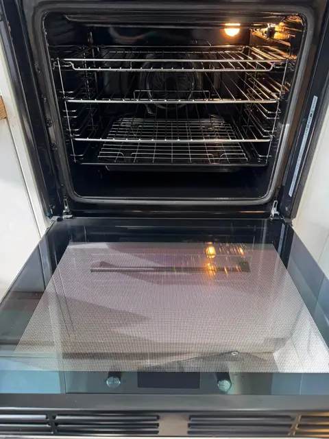 The same oven after an Eco Oven Cleaning deep clean, with clean door glass